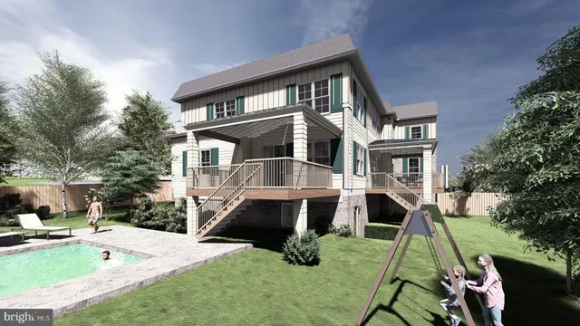 a view of a house with a yard and sitting area