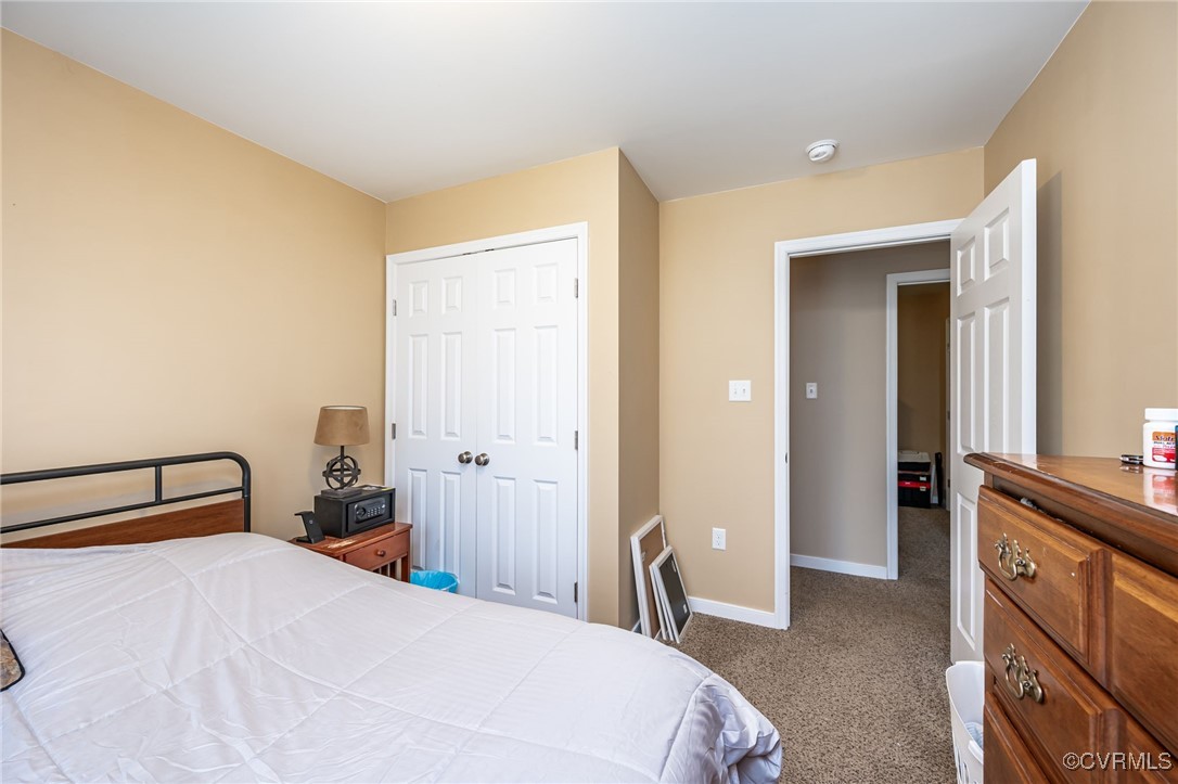 3847 Sage Road Sandy Hook, VA 23153 - Photo 21 of 37 a bedroom with a bed and a dresser