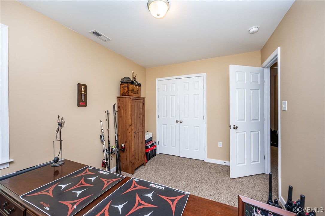 3847 Sage Road Sandy Hook, VA 23153 - Photo 23 of 37 a room with gym equipment and a window