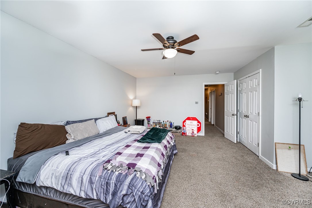 3847 Sage Road Sandy Hook, VA 23153 - Photo 27 of 37 a bedroom with a bed and a chandelier