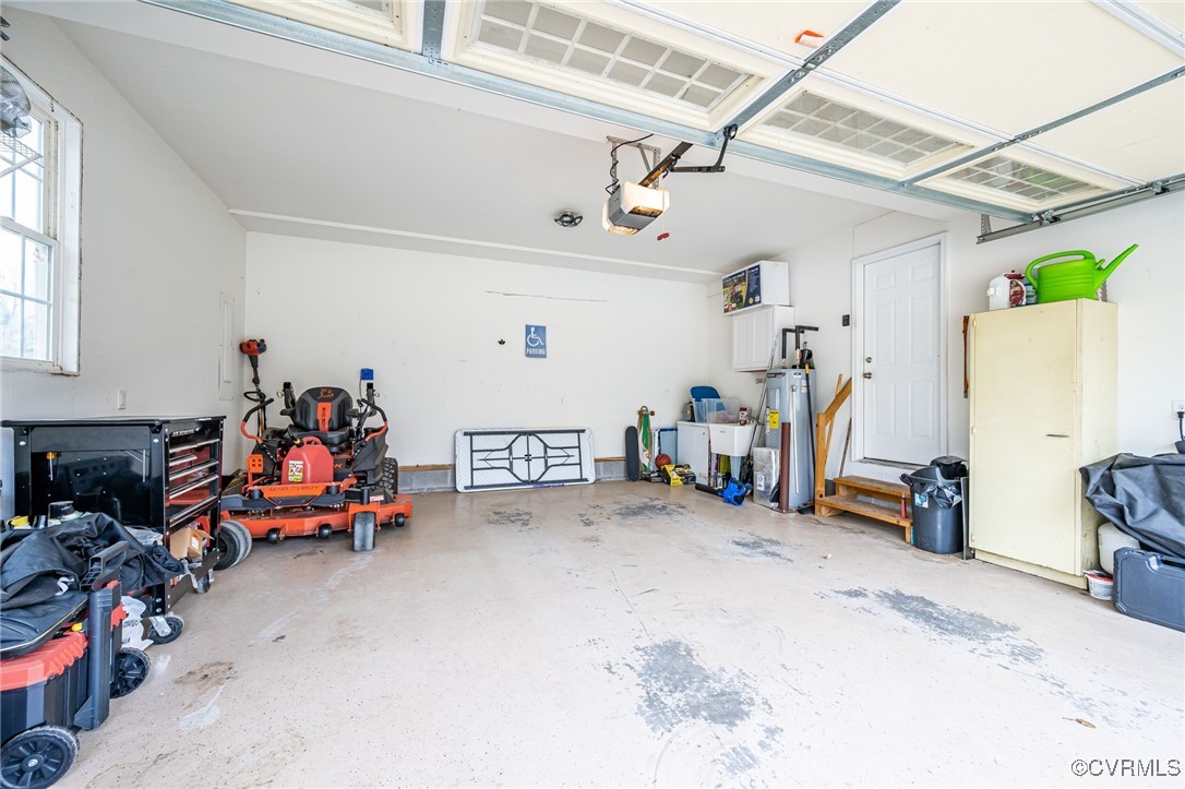 3847 Sage Road Sandy Hook, VA 23153 - Photo 29 of 37 a view of a garage with a bike and white walls