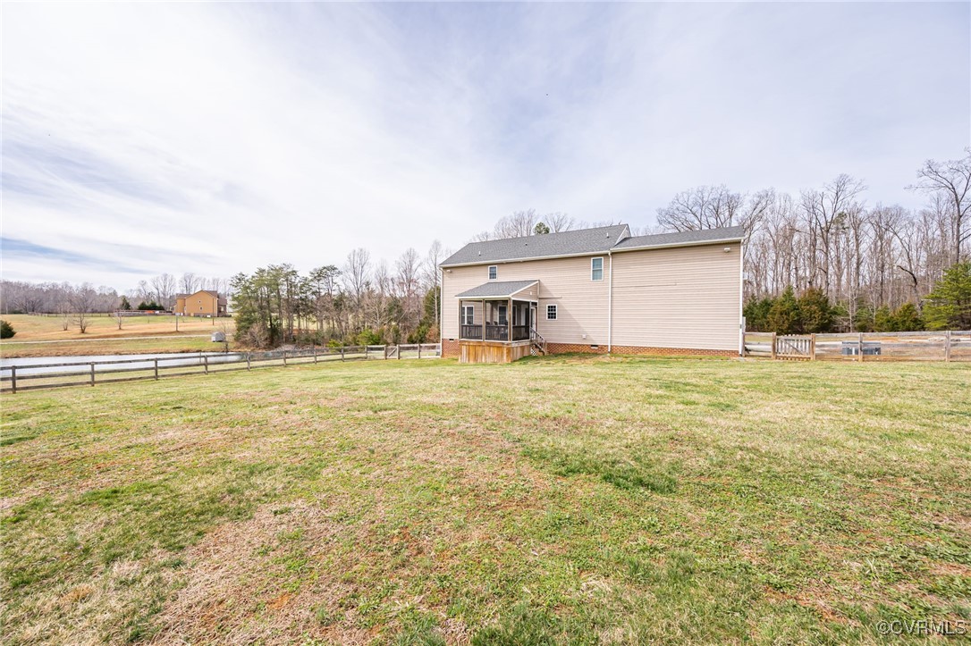 3847 Sage Road Sandy Hook, VA 23153 - Photo 31 of 37 a view of an house with backyard and trees