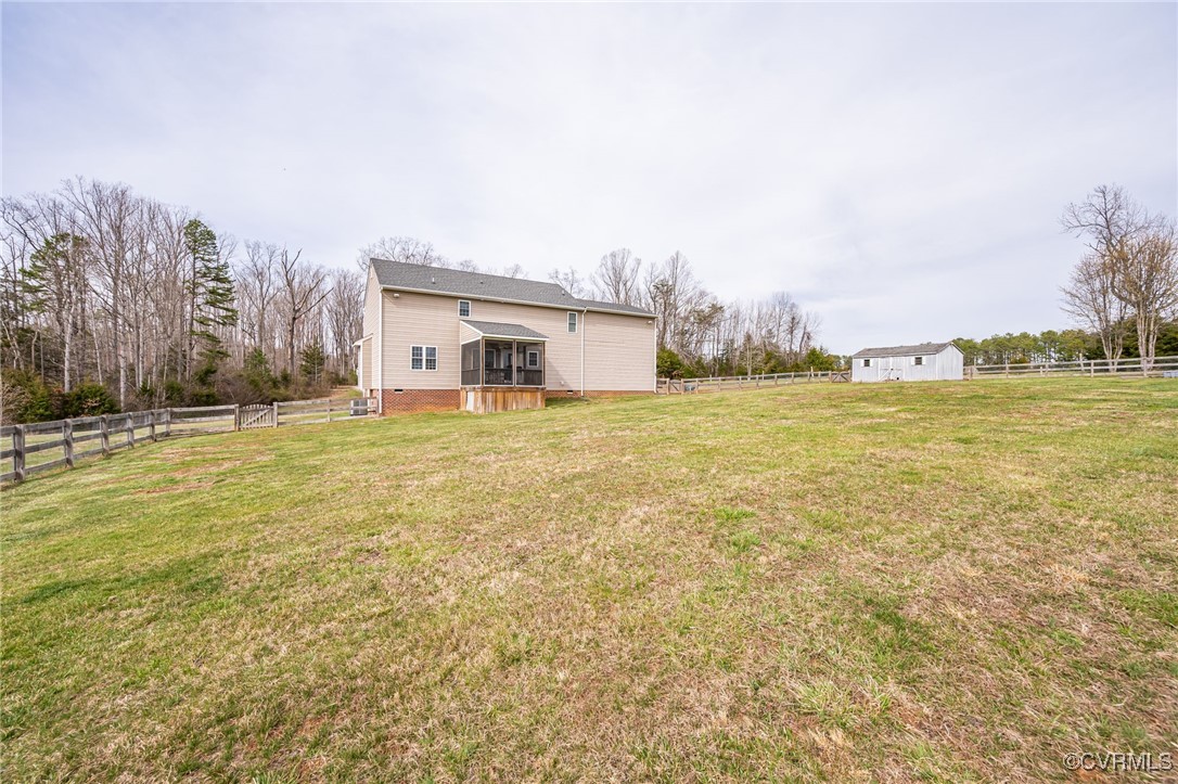 3847 Sage Road Sandy Hook, VA 23153 - Photo 33 of 37 a view of a large body of water with a building in the background