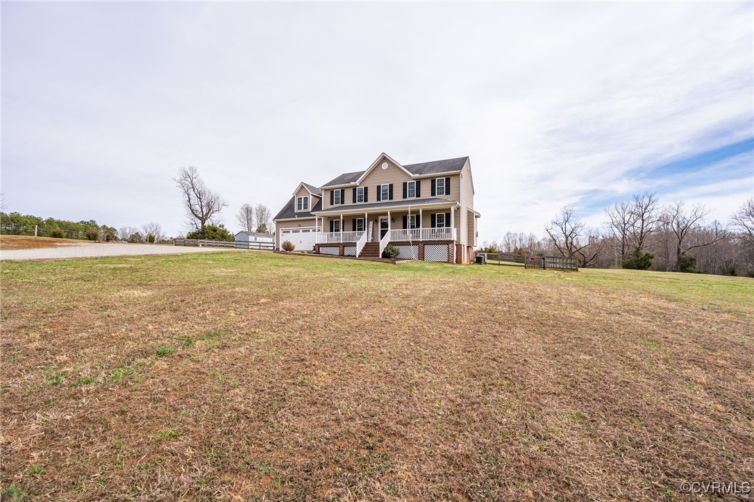 3847 Sage Road Sandy Hook, VA 23153 - Photo 8 of 37 a view of a house with a yard and a large tree