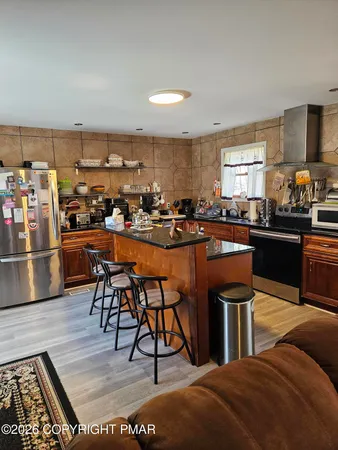 a living room with furniture a rug and a flat screen tv