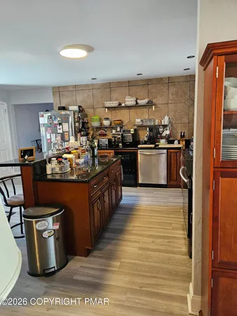 a living room with furniture rug and a window