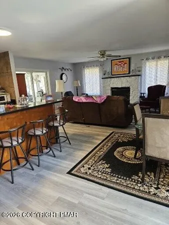 a view of a dining room with furniture window and wooden floor