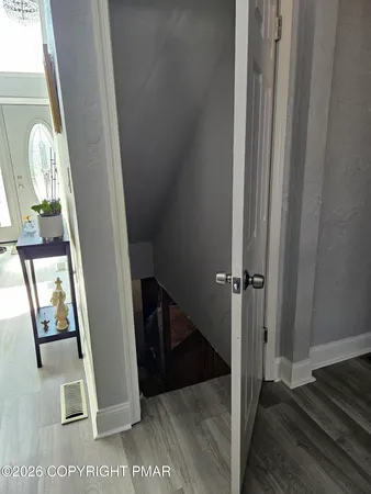 a view of a hallway with windows