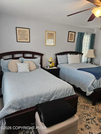 a bedroom with a bed and a couch