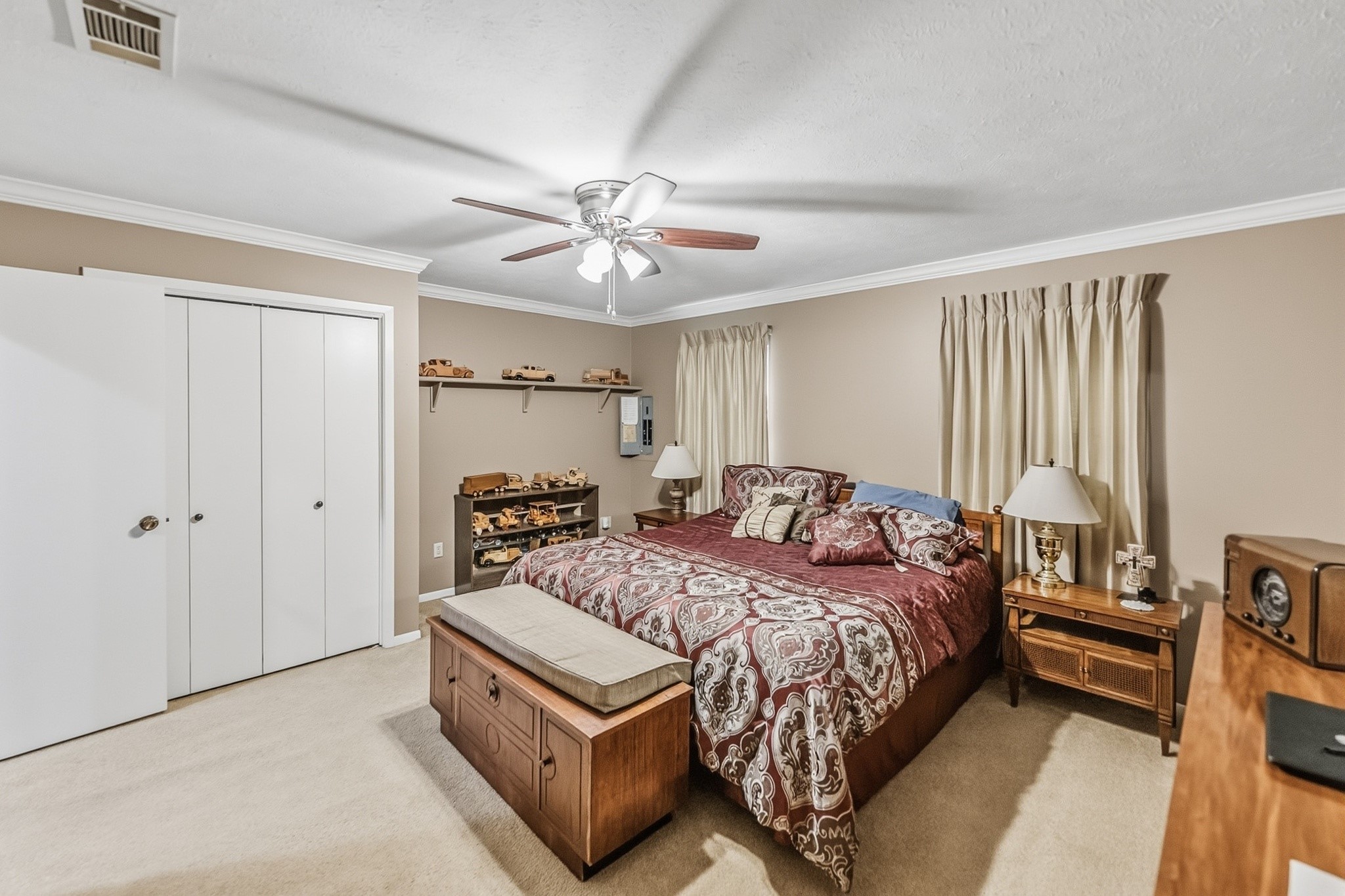 46 Point Loop Huntsville, TX 77320 - Photo 27 of 49 a bedroom with a bed and a chandelier
