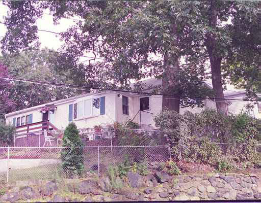 105 Hardy Pond Road Waltham, MA 02451 - Photo 1 of 1 a view of a yard in front of a house