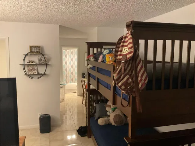 a bedroom with furniture and a lamp