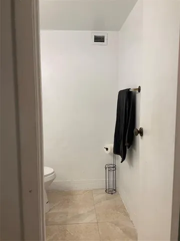 a reading room with furniture and a window