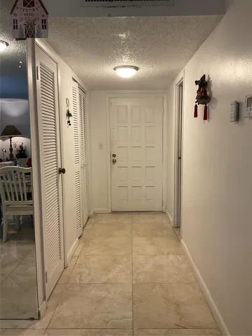 a bedroom with a bed and flat screen tv