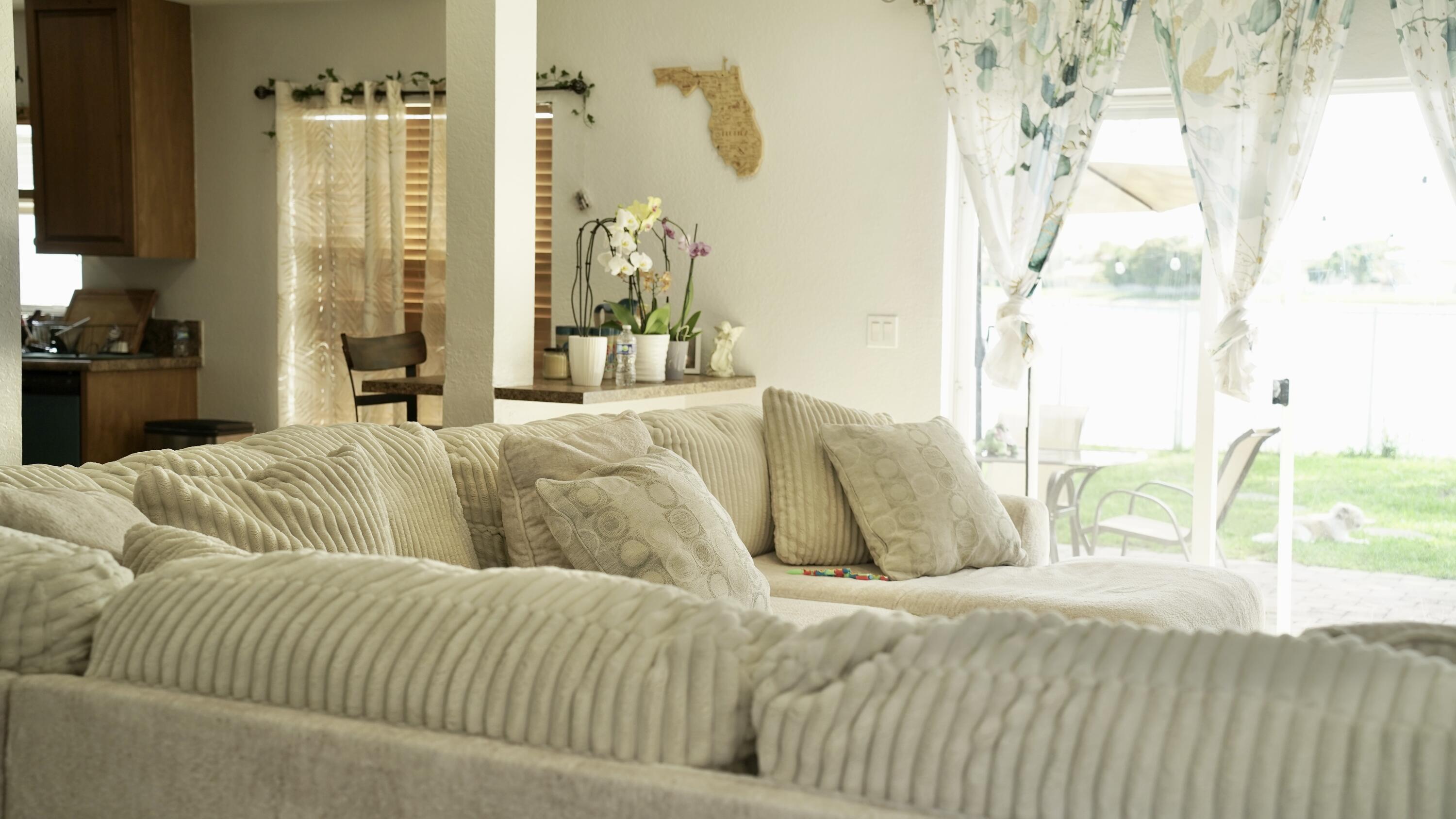 3290 Turtle Cove West Palm Beach, FL 33411 - Photo 11 of 55 a bed sitting in a bedroom next to a window