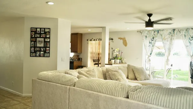 a living room with furniture and a large window