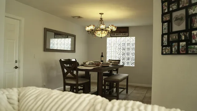 a bedroom with a bed and a table