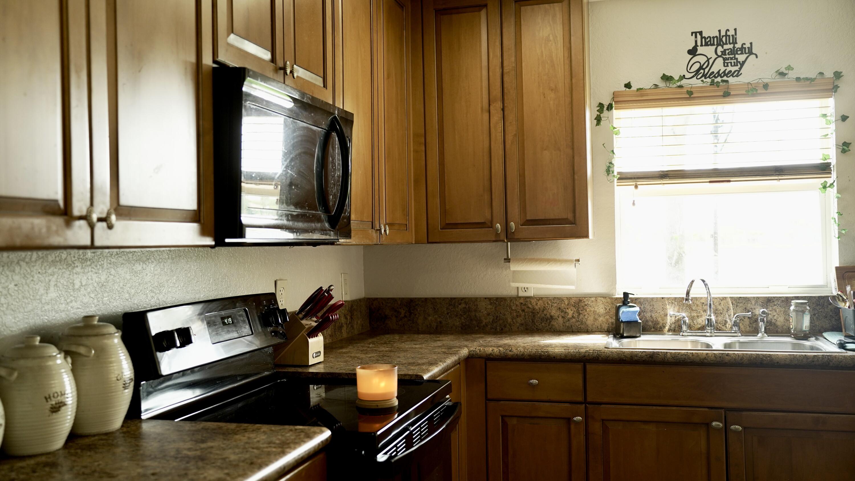 3290 Turtle Cove West Palm Beach, FL 33411 - Photo 17 of 55 a kitchen with a sink and cabinets