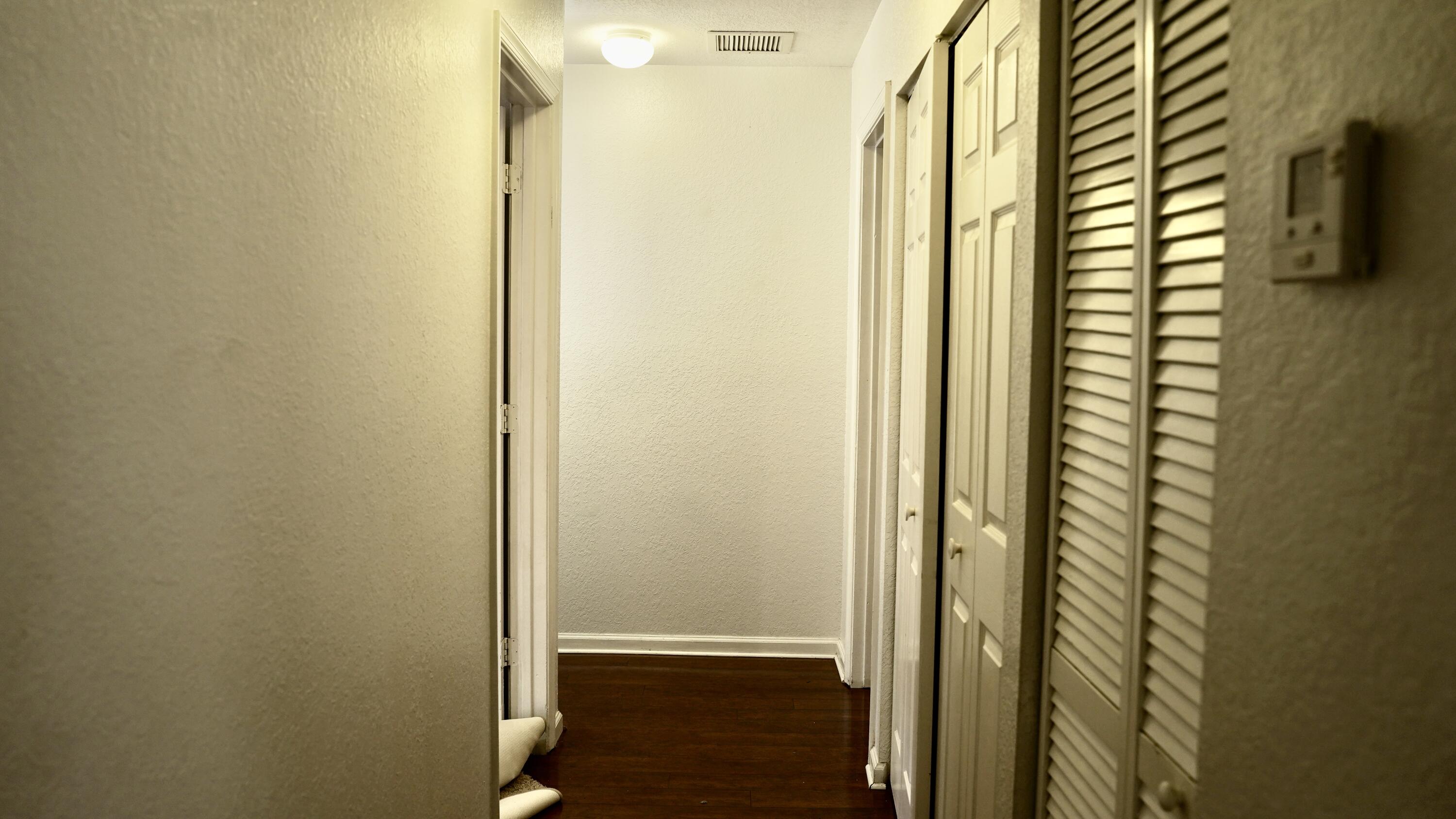 3290 Turtle Cove West Palm Beach, FL 33411 - Photo 26 of 55 a view of a bathroom from a hallway