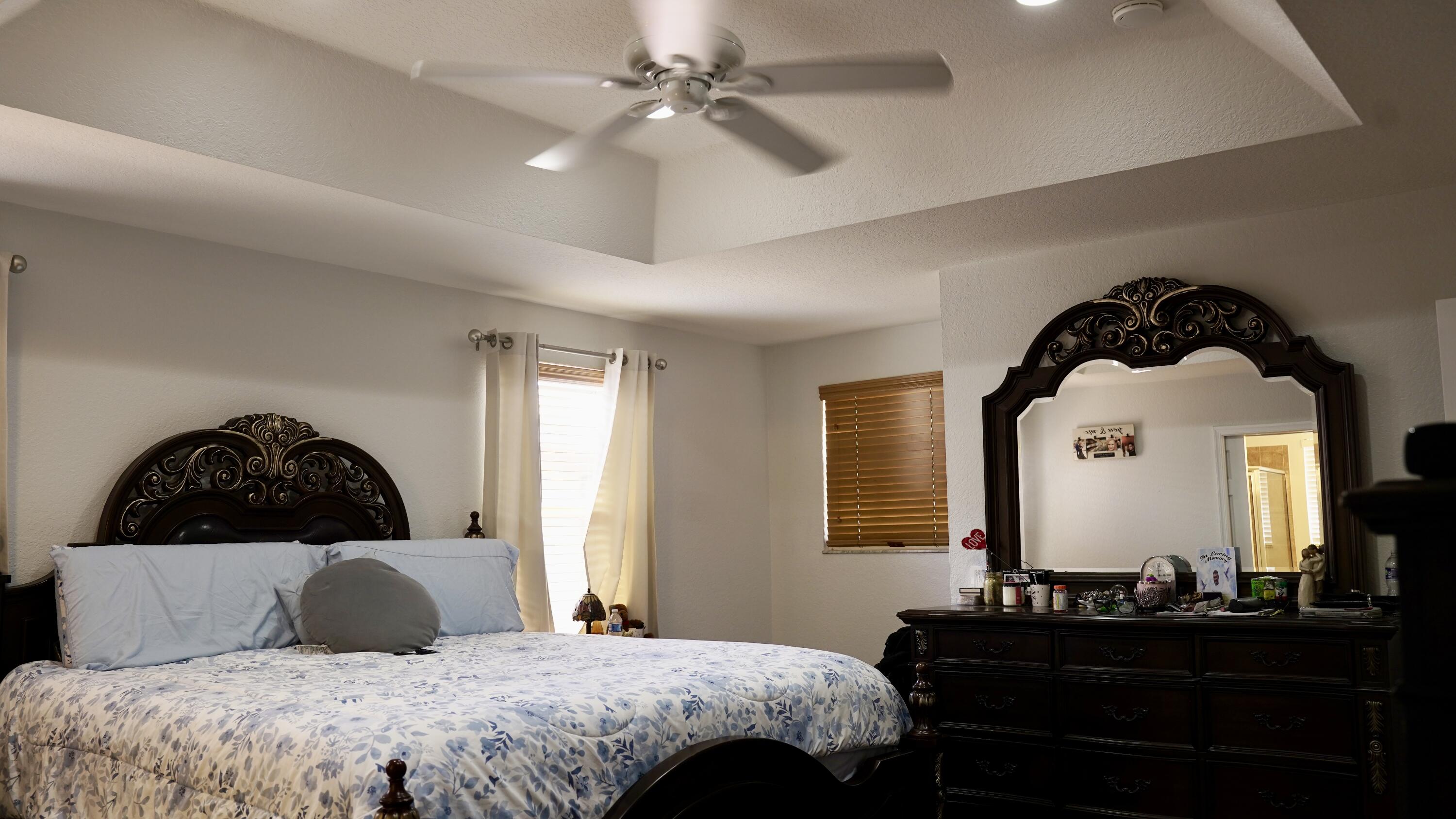 3290 Turtle Cove West Palm Beach, FL 33411 - Photo 27 of 55 a bedroom with a bed a dresser and mirror