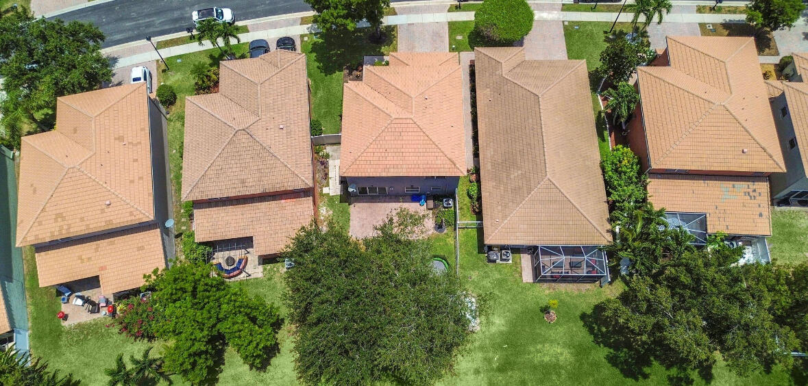 3290 Turtle Cove West Palm Beach, FL 33411 - Photo 3 of 55 an aerial view of a house with a garden and plants