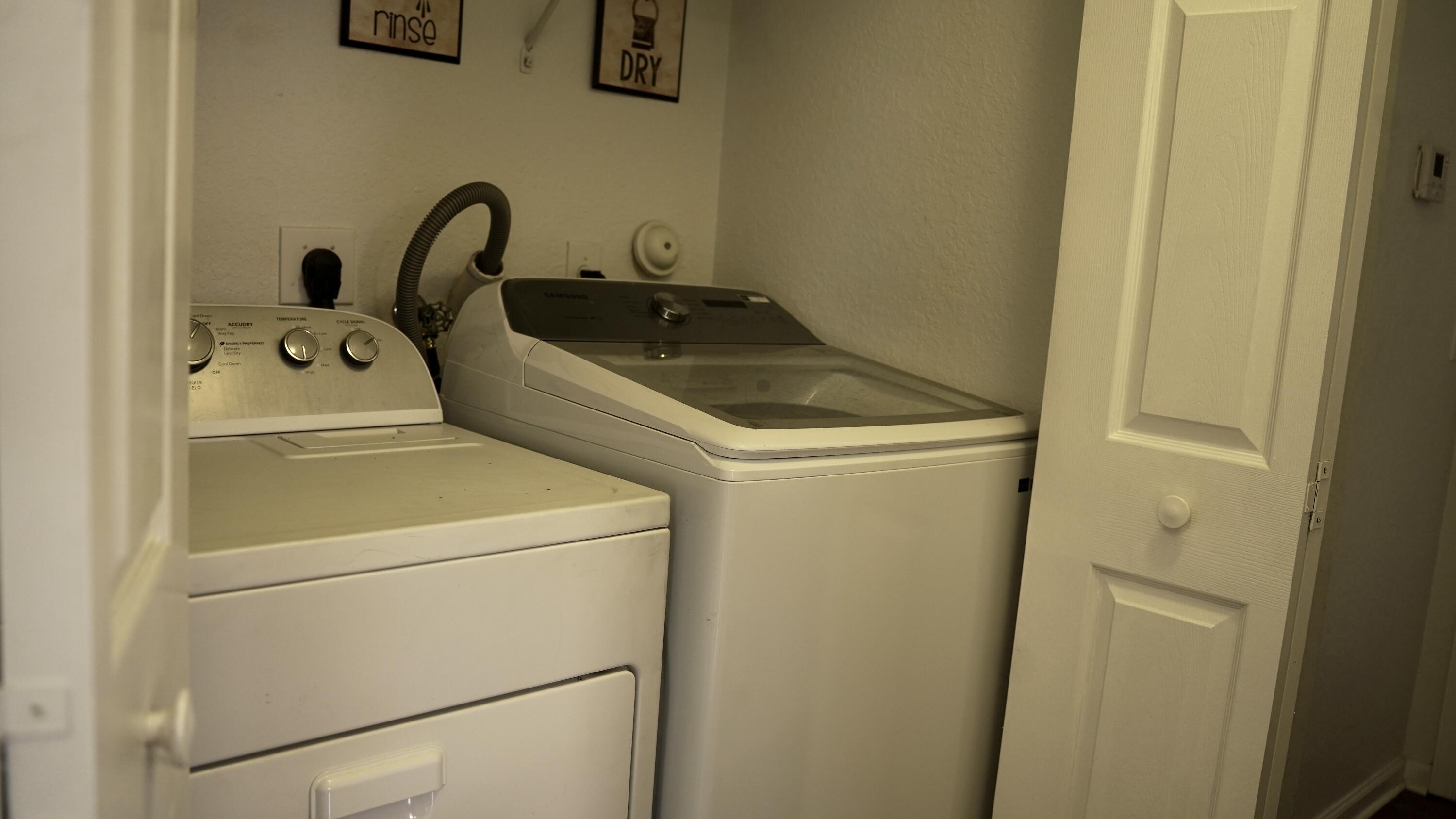 3290 Turtle Cove West Palm Beach, FL 33411 - Photo 35 of 55 a close up view of washer and dryer