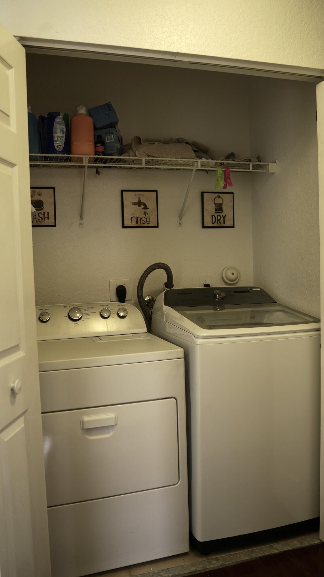 3290 Turtle Cove West Palm Beach, FL 33411 - Photo 36 of 55 a close up of a washer and dryer