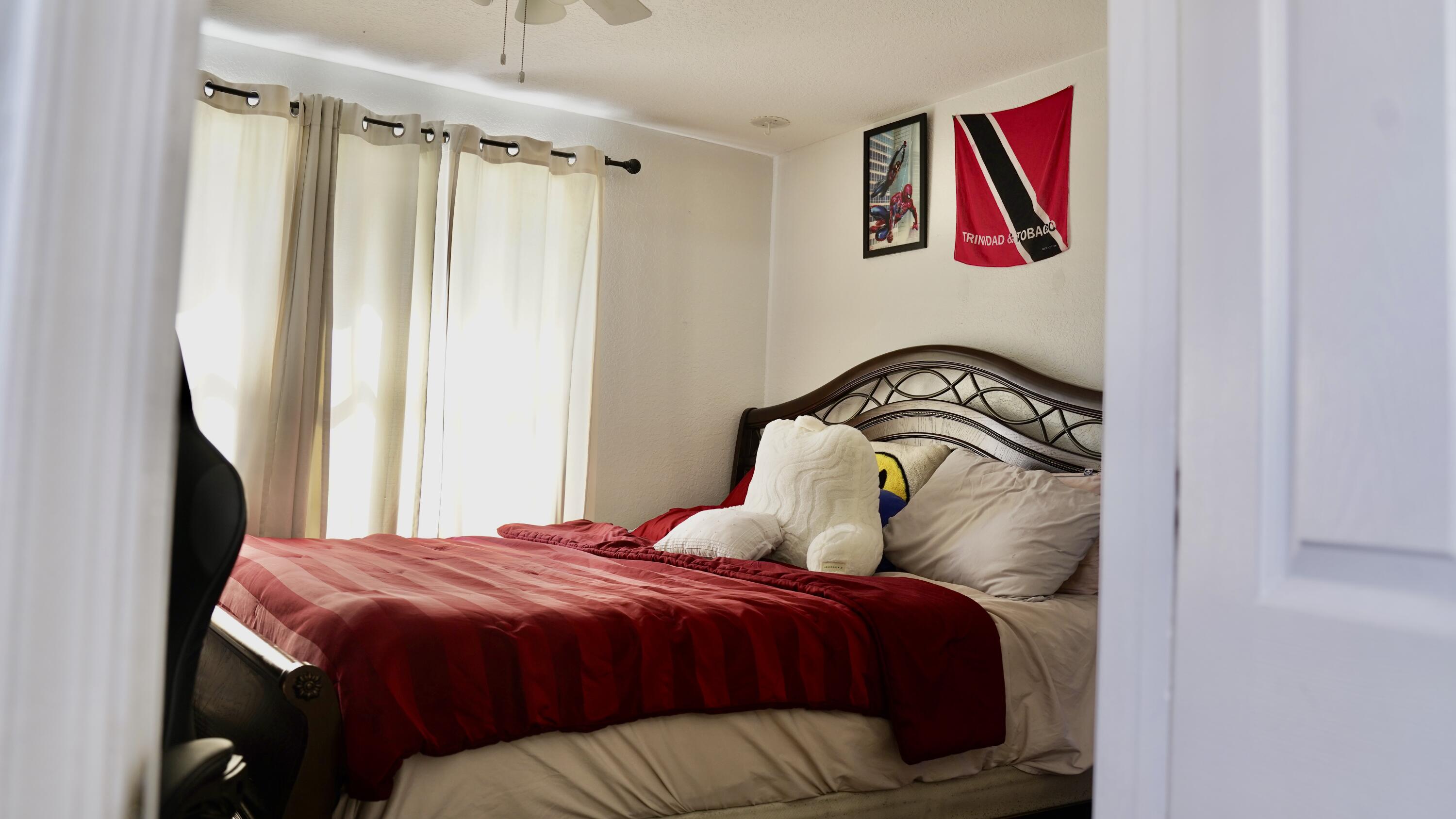 3290 Turtle Cove West Palm Beach, FL 33411 - Photo 38 of 55 a bedroom with a bed and a window