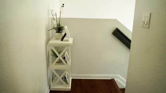 a view of a house with sitting area and garden