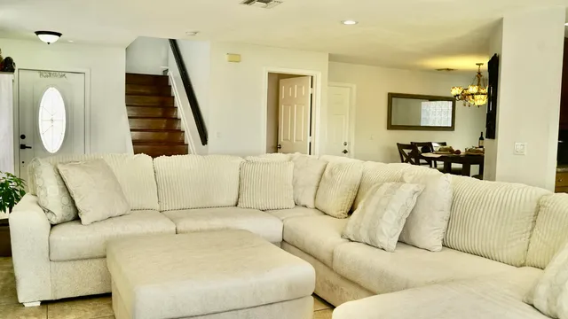 a view of a dining room with furniture and wooden floor