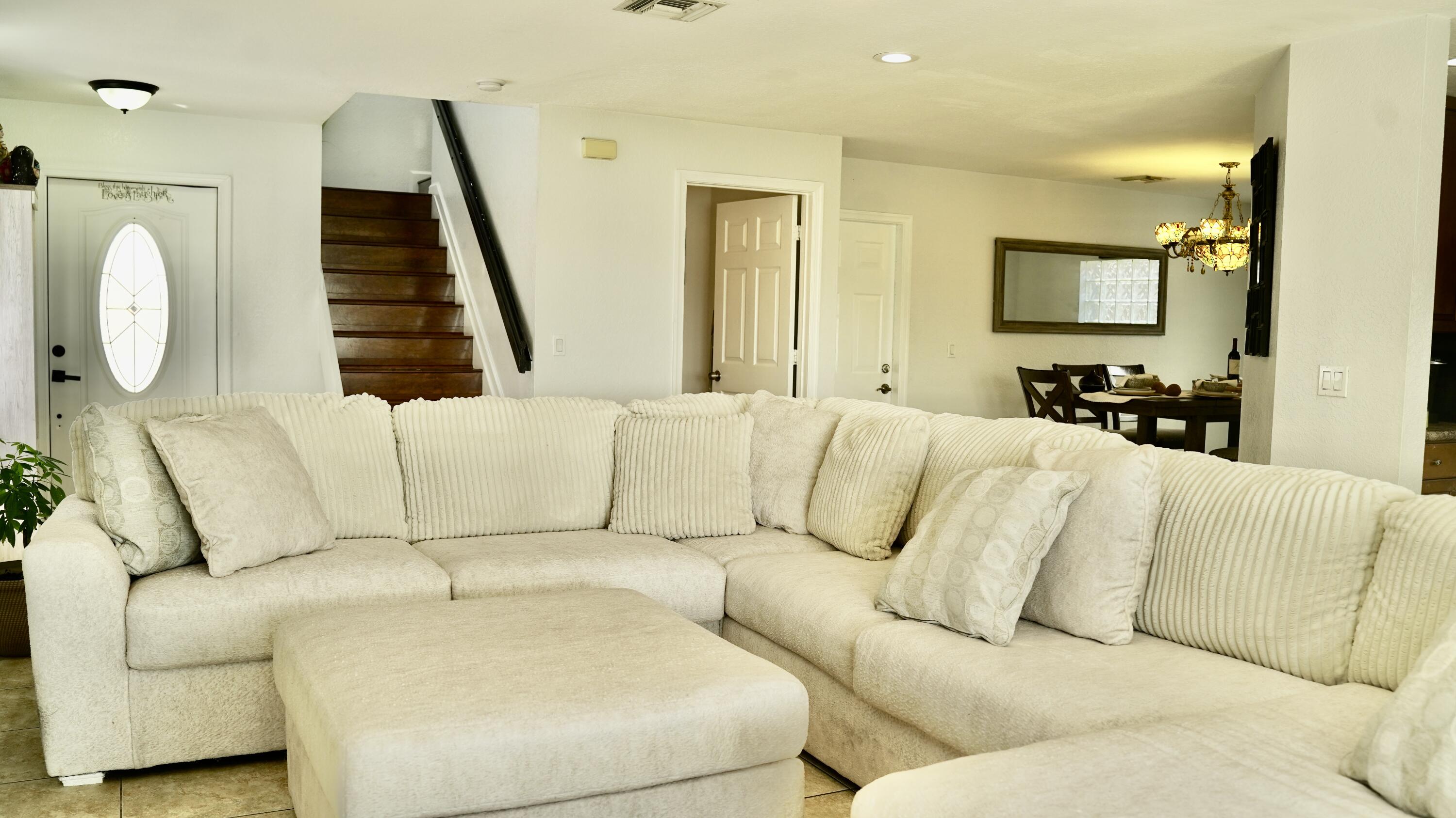 3290 Turtle Cove West Palm Beach, FL 33411 - Photo 44 of 55 a living room with furniture and a window