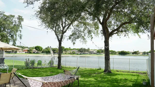 a view of a wooden deck and a yard