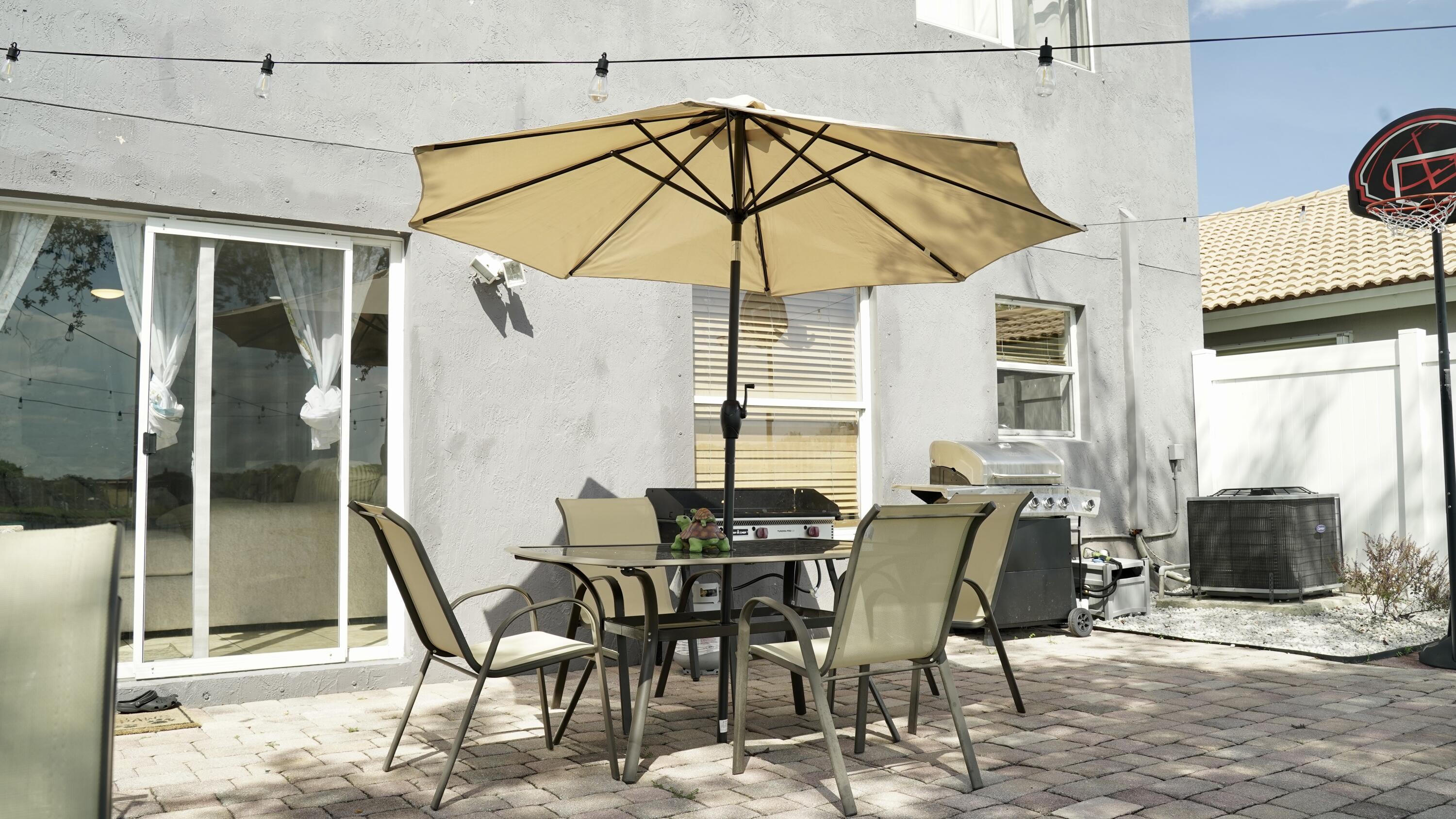 3290 Turtle Cove West Palm Beach, FL 33411 - Photo 48 of 55 a view of a dining room with furniture and wooden floor