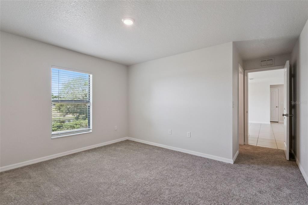 1613 Orne Street Mascotte, FL 34753 - Photo 20 of 31 an empty room with windows