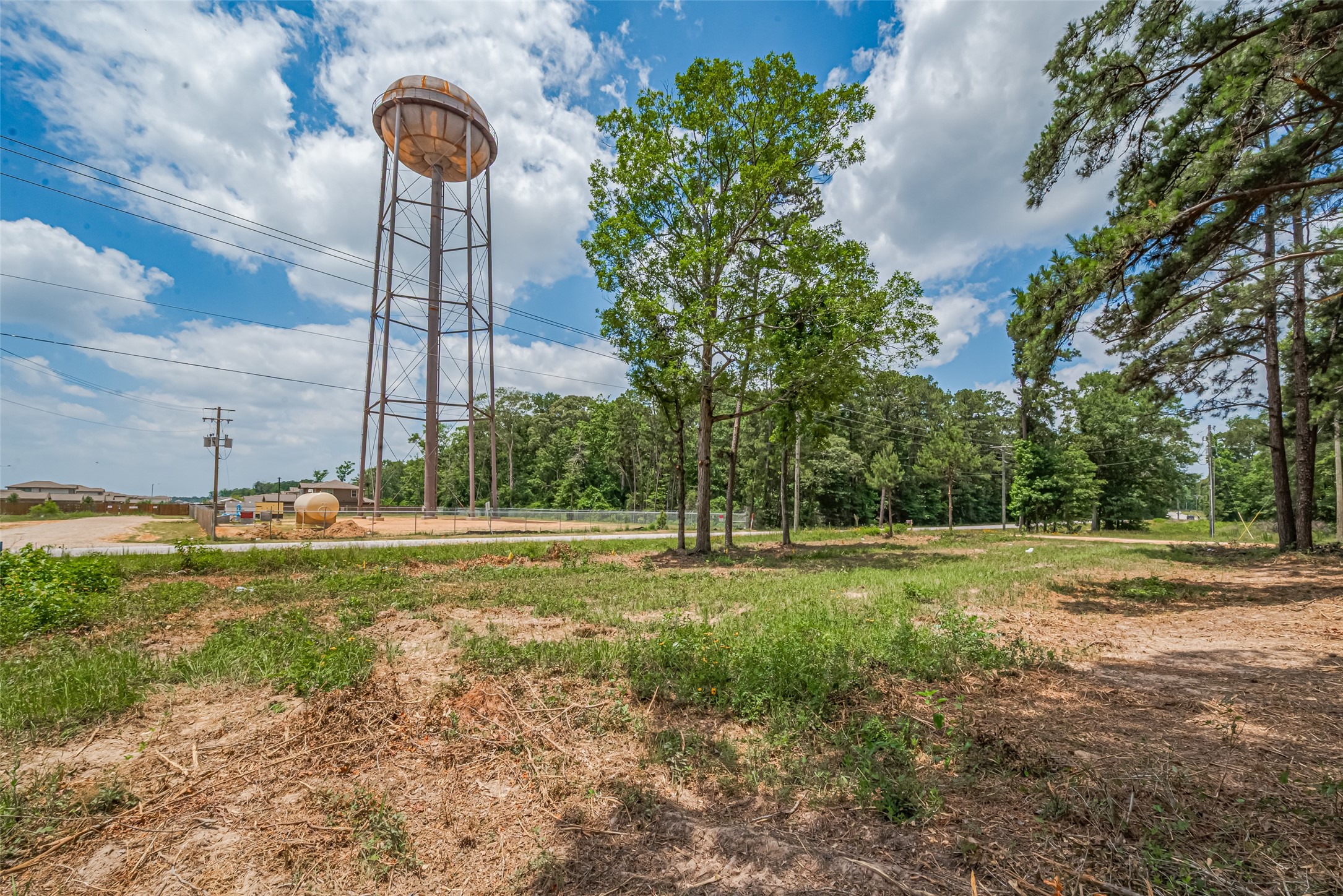 13907 Willis Waukegan Road Conroe, TX 77303 - Photo 13 of 18 a backyard of a house with a yard and outdoor seating
