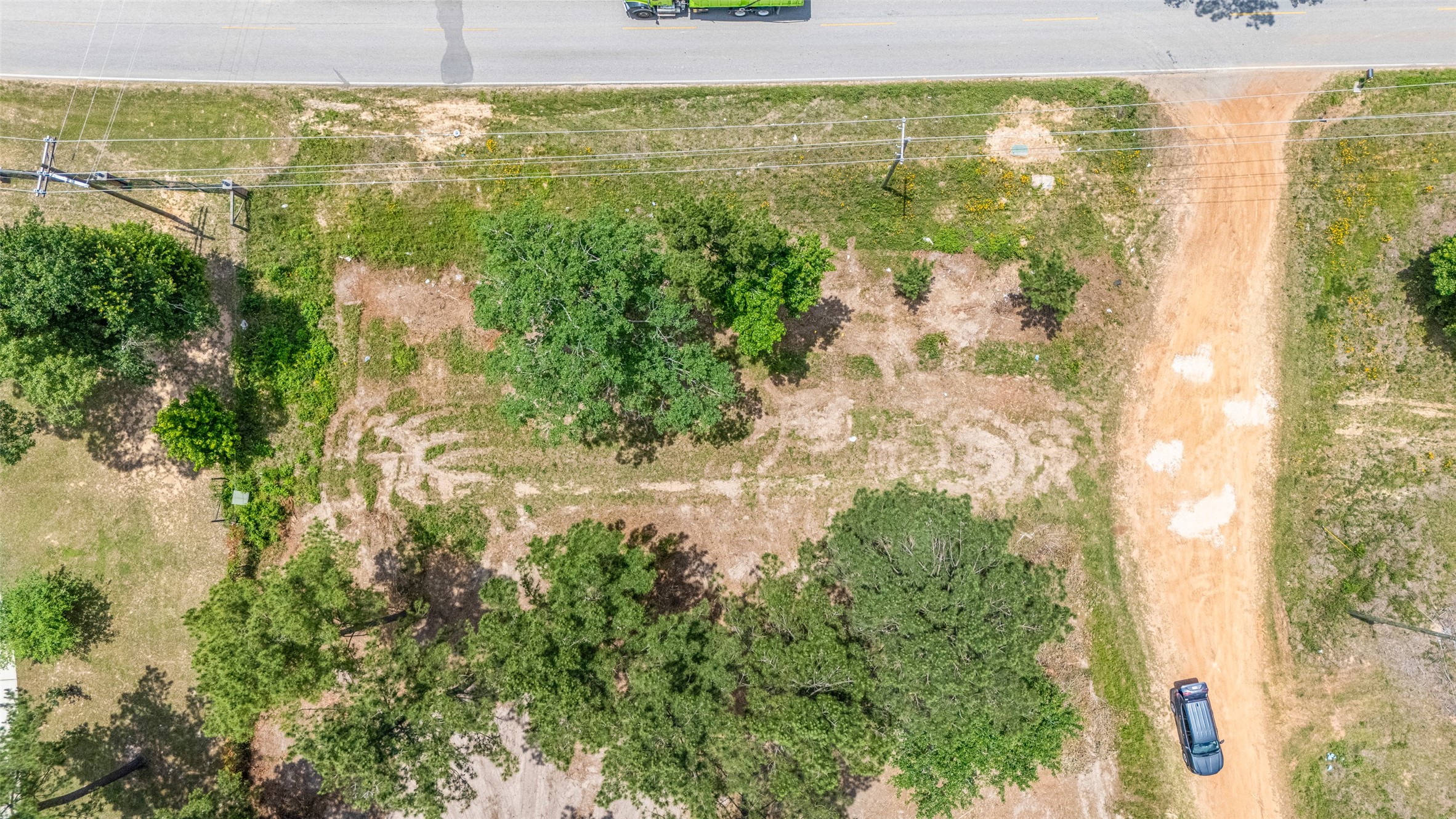 13907 Willis Waukegan Road Conroe, TX 77303 - Photo 2 of 18 a view of a lake from a yard