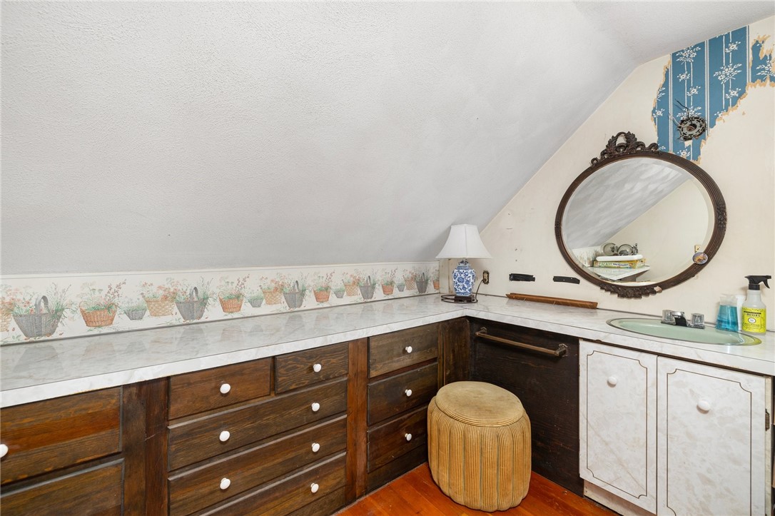 786 Sandy Lane Warwick, RI 02889 - Photo 18 of 26 The second, upstairs bedroom has additional space for a large closet and oversized vanity area.