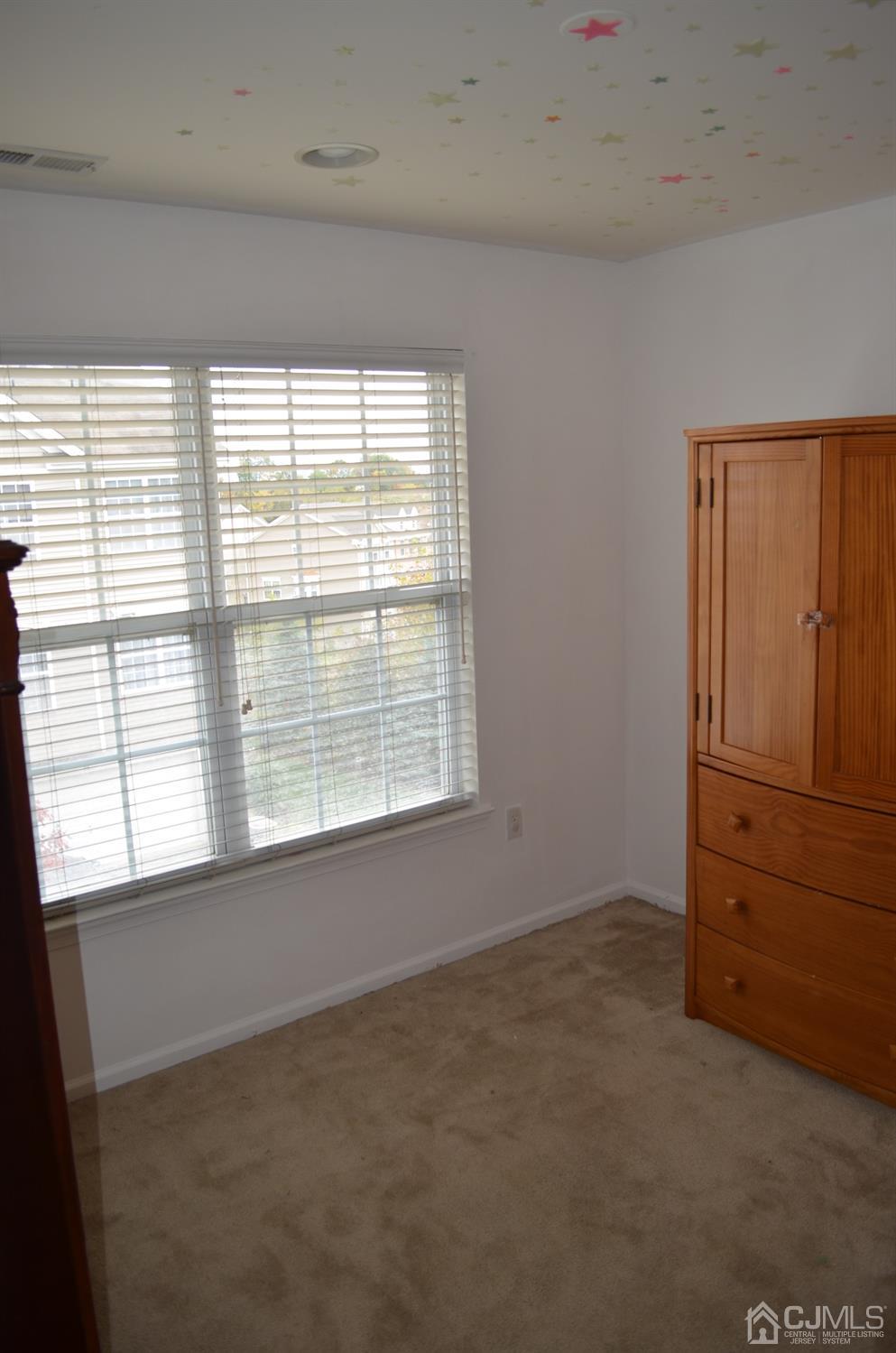 37 Rojewski Way, Unit 1471 Sayreville, NJ 08859 - Photo 14 of 28 an empty room with windows