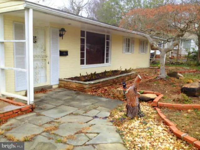 a view of a livingroom with an empty space and a fireplace