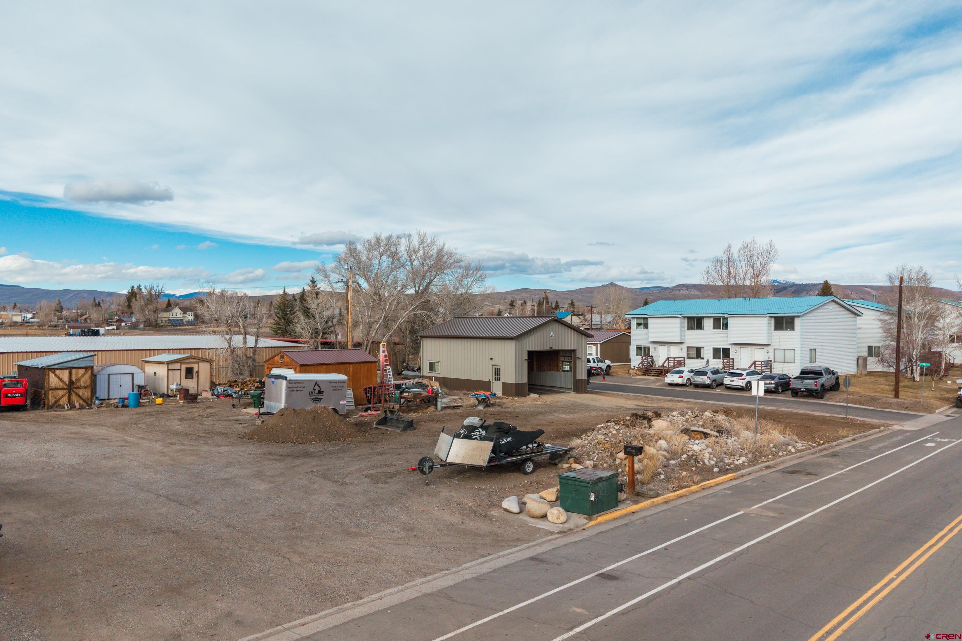 300 West Rio Grande Avenue Gunnison, CO 81230 - Photo 2 of 23 a view of a cars park in front of a building