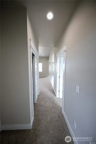 a view of hallway with livingroom