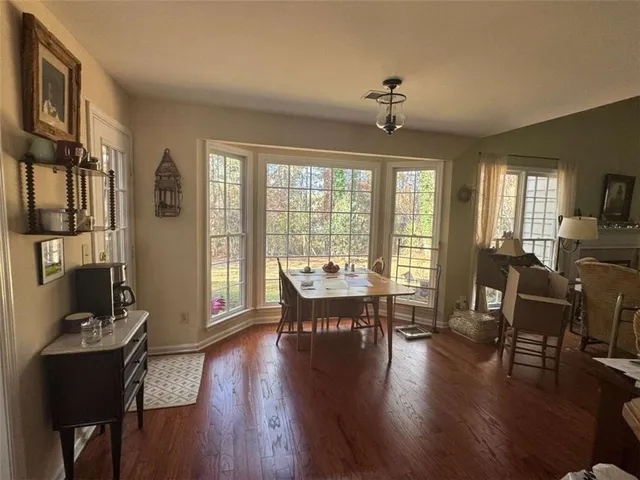 a bedroom with bed and a chandelier