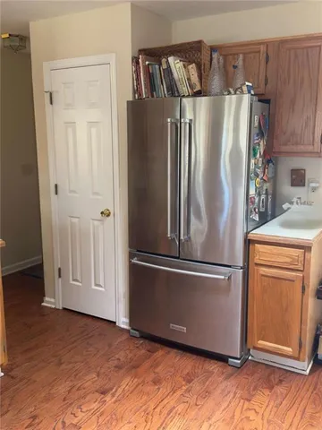 a view of a livingroom with furniture window and wooden floor