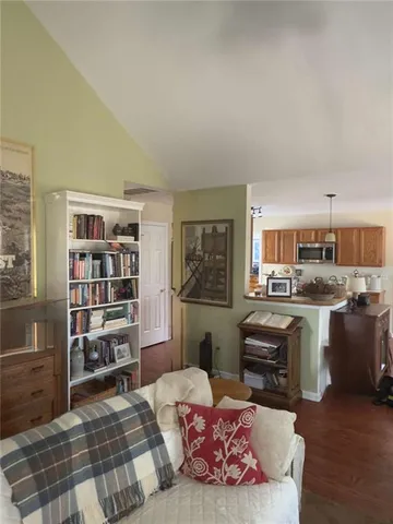 a living room with furniture fireplace and a table