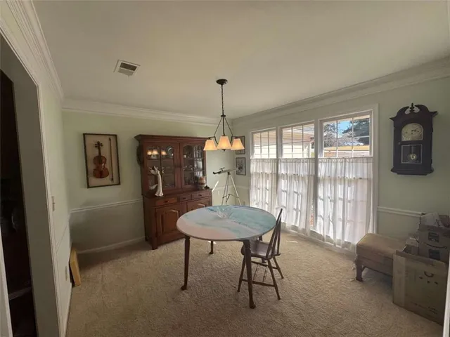 a kitchen with stainless steel appliances a stove a microwave a sink and cabinets