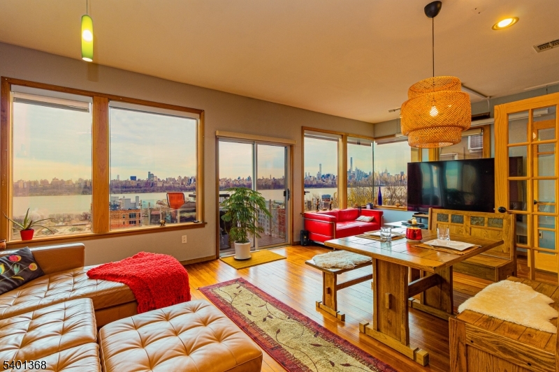 a very nice looking room with a large window and dining table