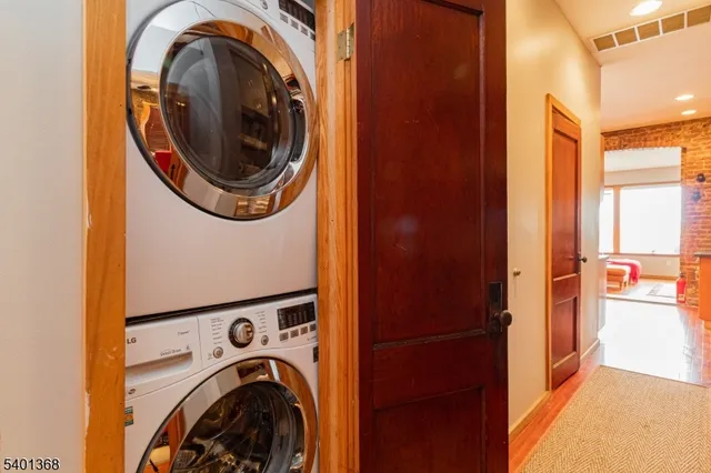 a view of a hallway with washer and dryer