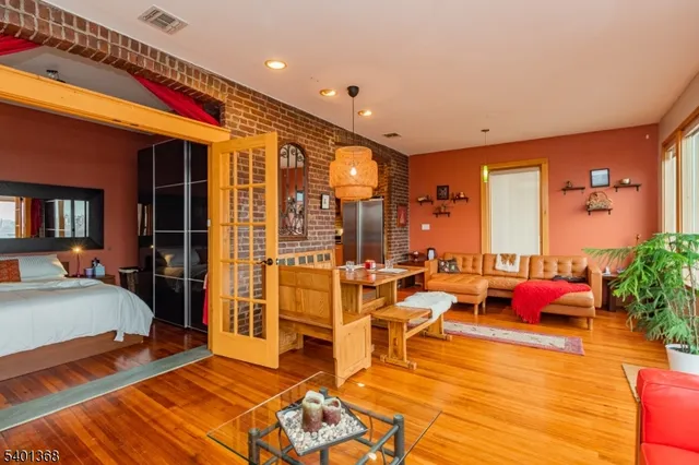 a very nice looking room with a large window and furniture