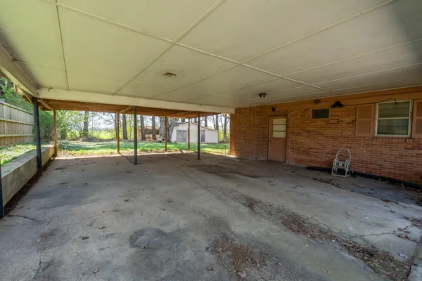 a view of an empty room with a large window
