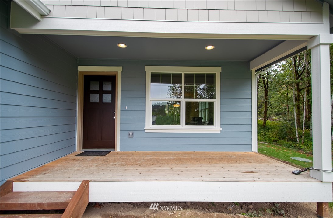 16716 Erickson Road Southwest Longbranch, WA 98351 - Photo 2 of 17 a front view of a house having yard
